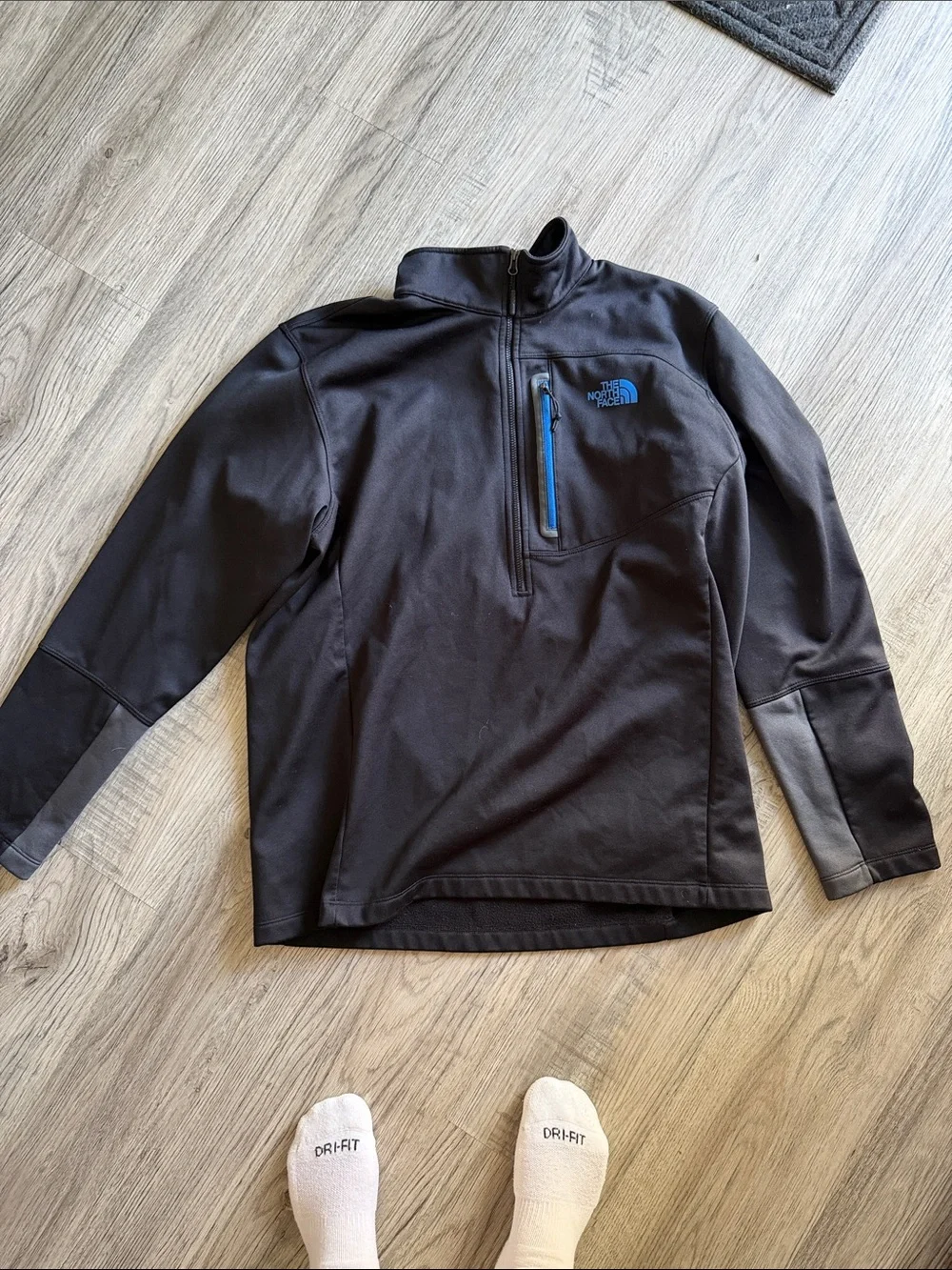 The North Face Black Half-Zip Pullover with Blue Chest Zip